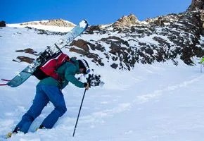 Jonathan Cooper booting up a scenic couloir.