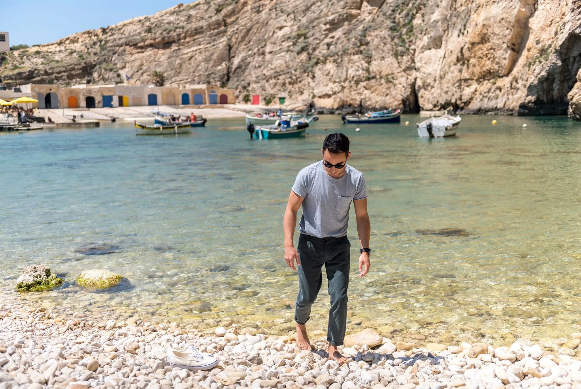 man walking along beach