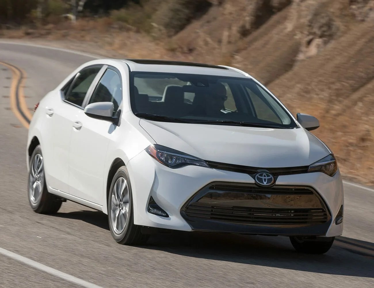 toyota corolla driving on highway