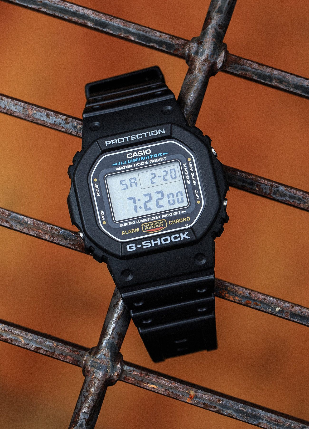 g shock watch on a fence
