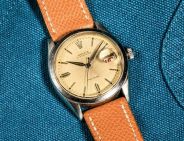 vintage rolex on blue background