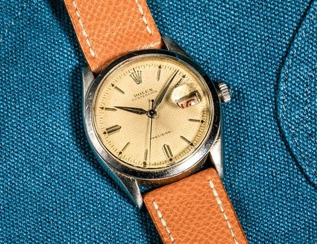 vintage rolex on blue background