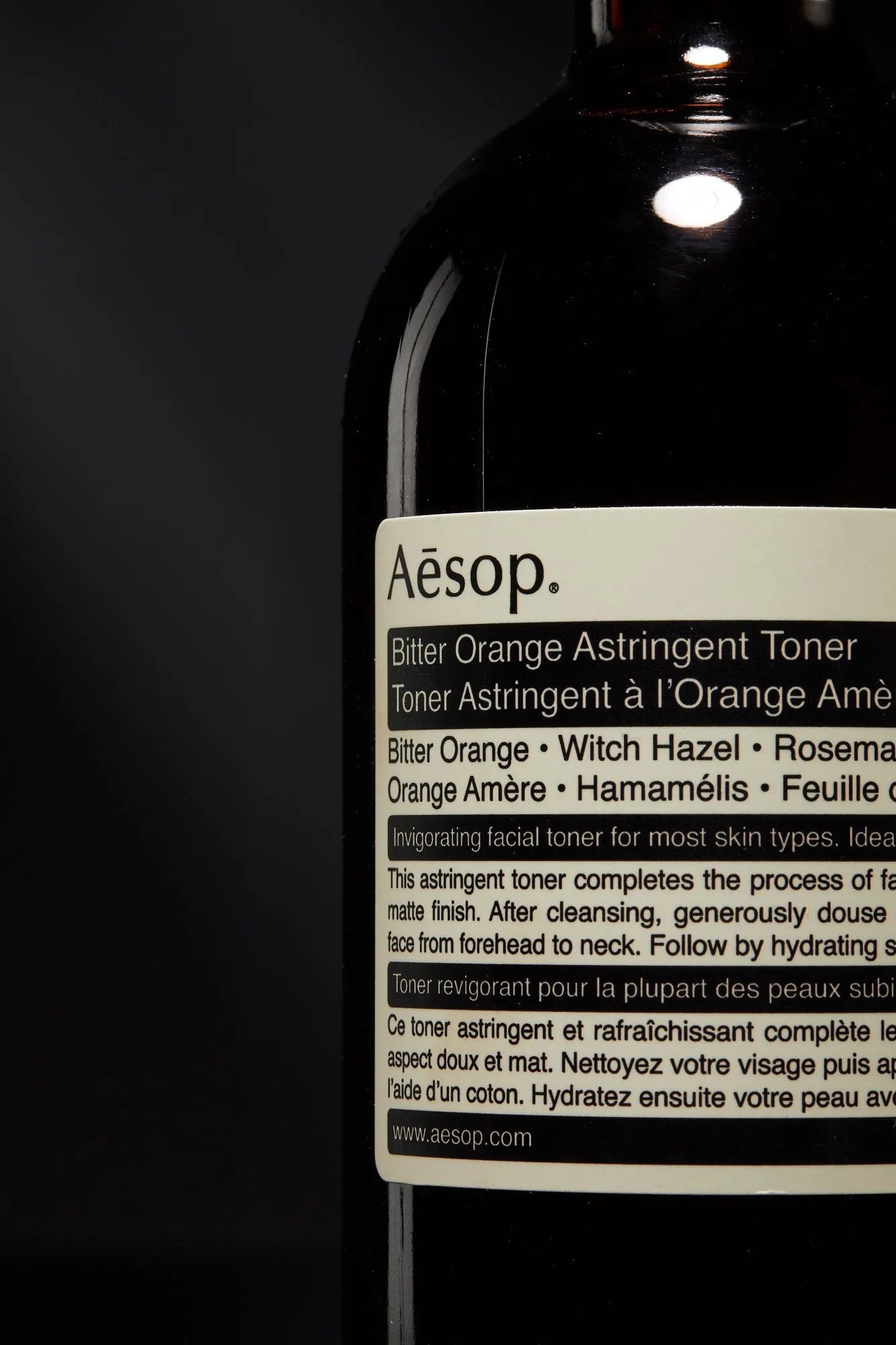 close up of aesop bitter orange astringent toner bottle and label