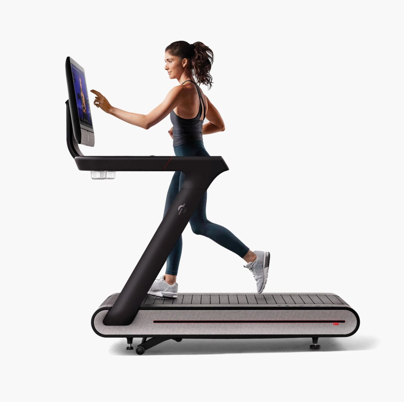 woman running on peloton treadmill