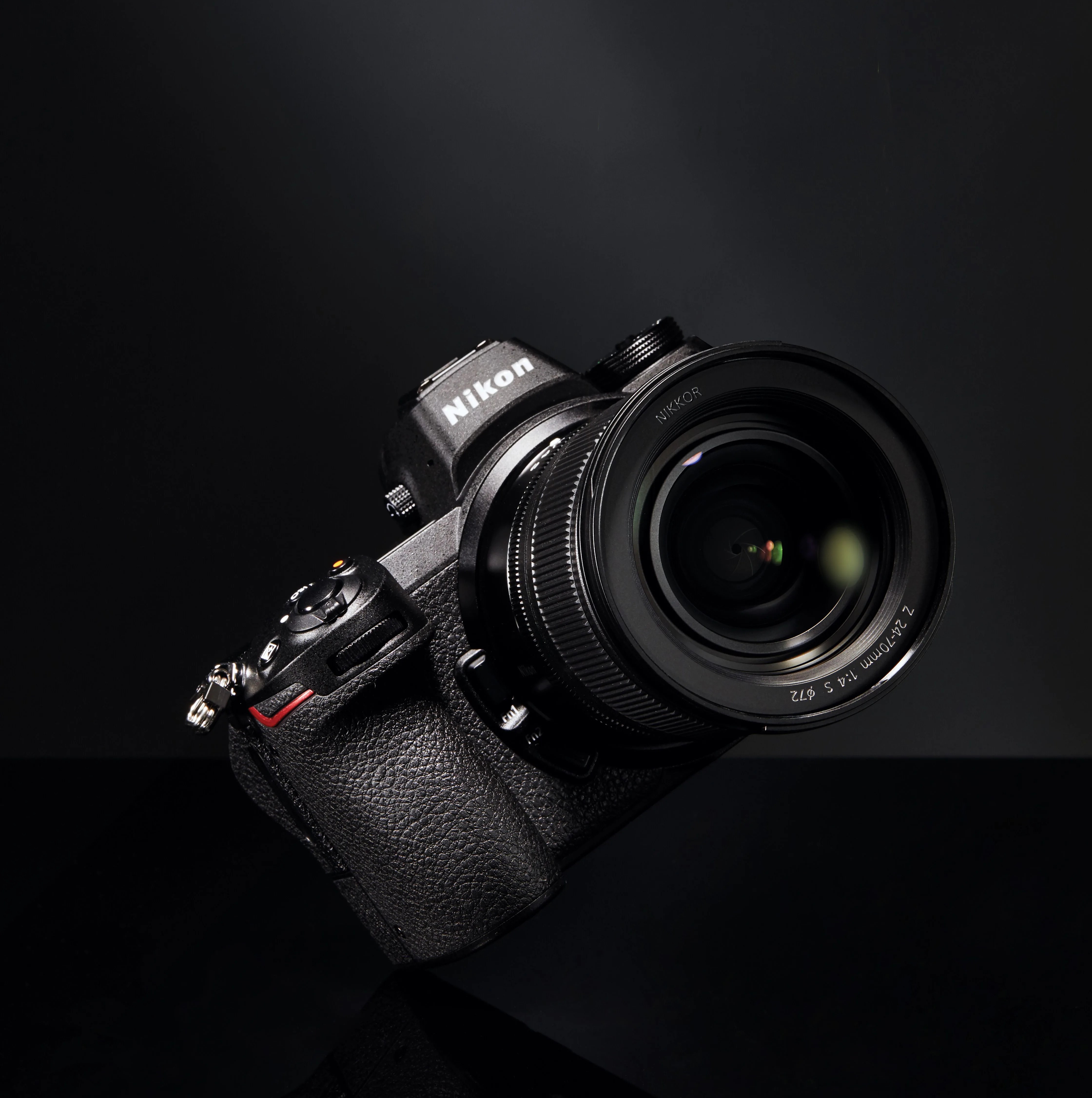 black nikon camera with lens