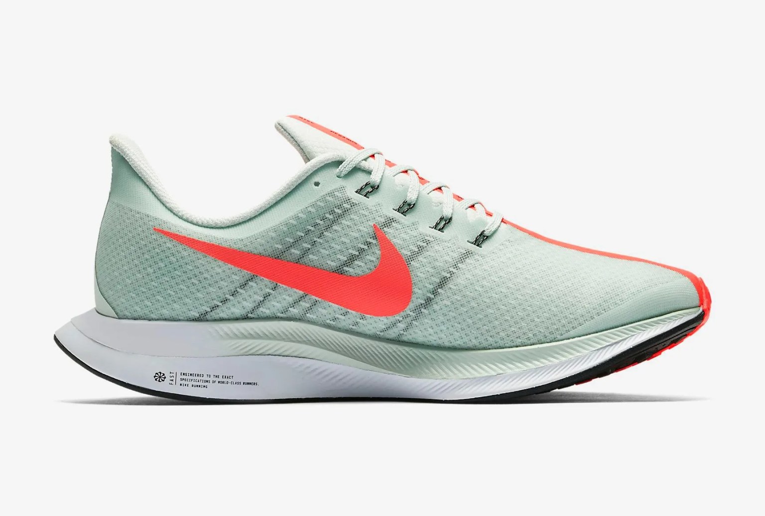 green nike sneaker with curvy sole and hot pink nike check logo