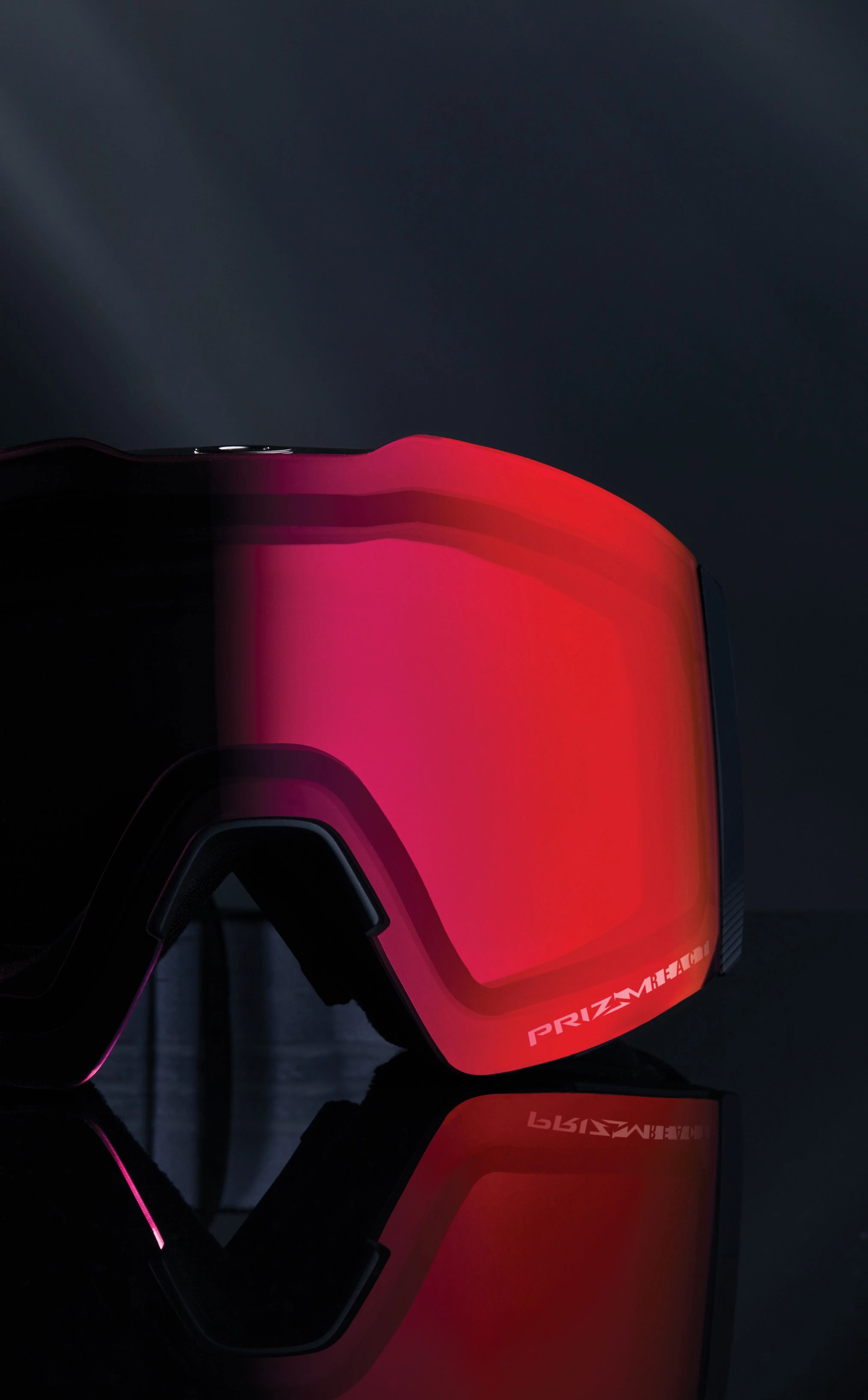 close up of oakley prizm ski goggles with red lenses