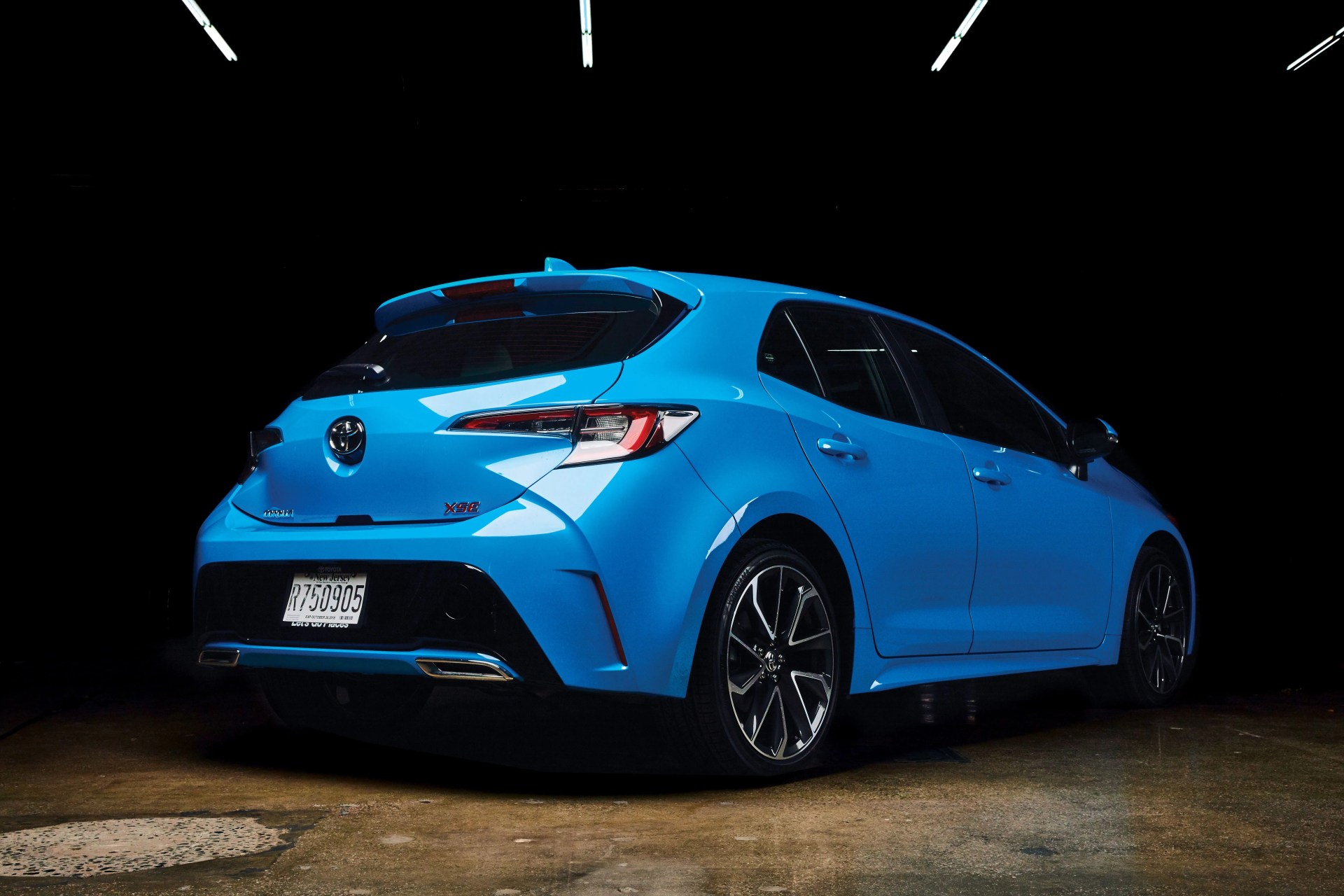 back view of a blue toyota car