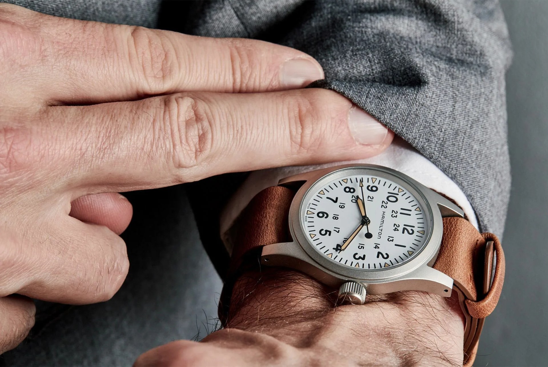 white dial hamilton khaki field mechanical watch on wrist
