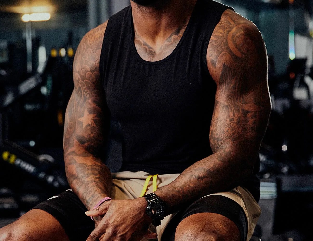 How-Three-Personal-Trainers-Dress-for-the-Gym-Gear-Patrol-walaco-tank-top