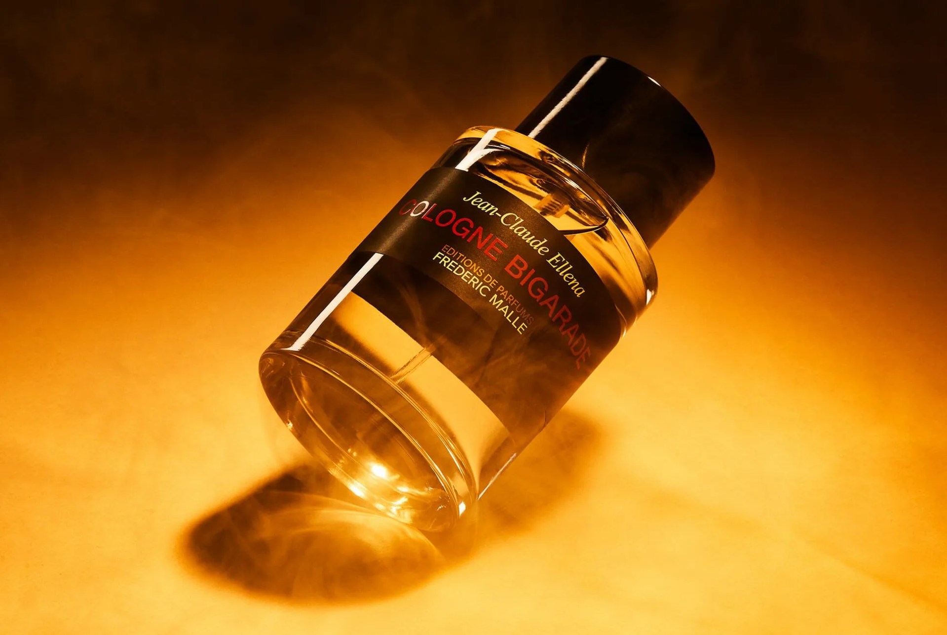 bottle of cologne surrounded by smoke
