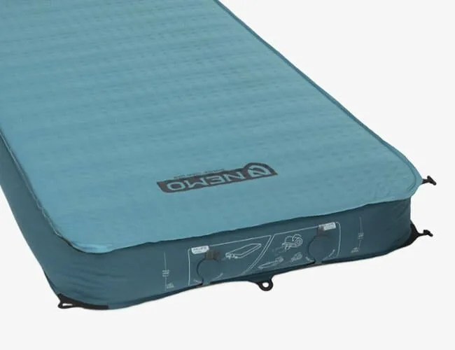 a blue inflatable sleeping pad for camping on a white background