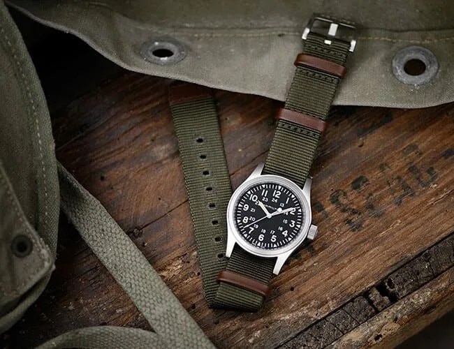 hamilton khaki field watch on a wooden table