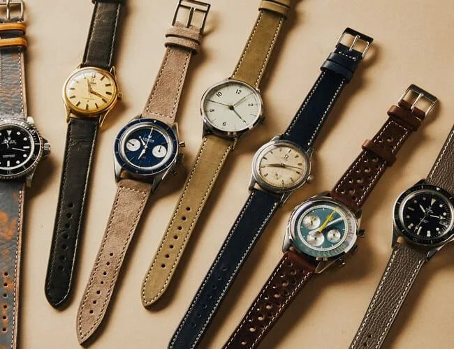 watches on leather straps lying on a table