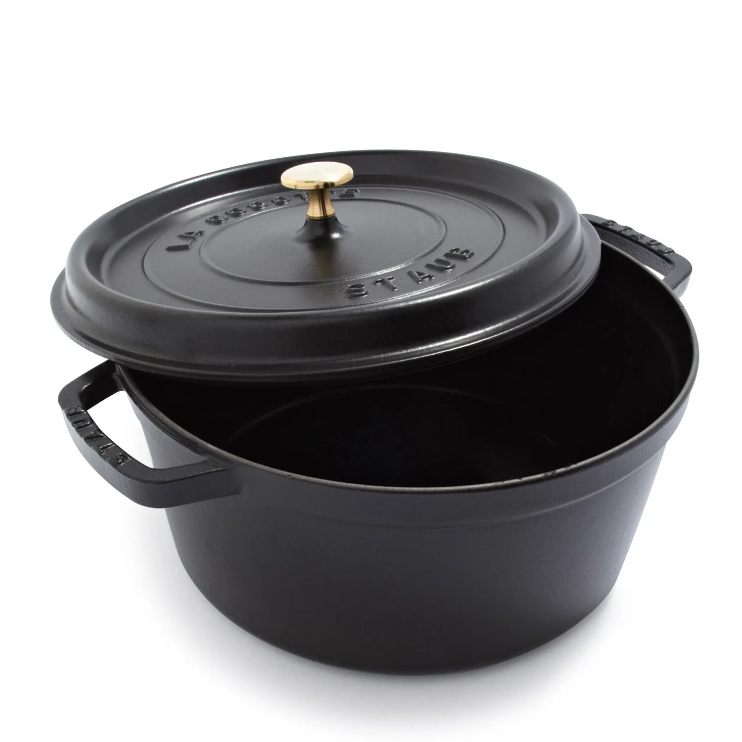 A black Staub Dutch oven and lid on a white background.