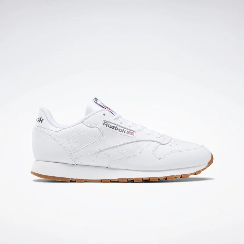 White Reebok leather shoe on a white background.