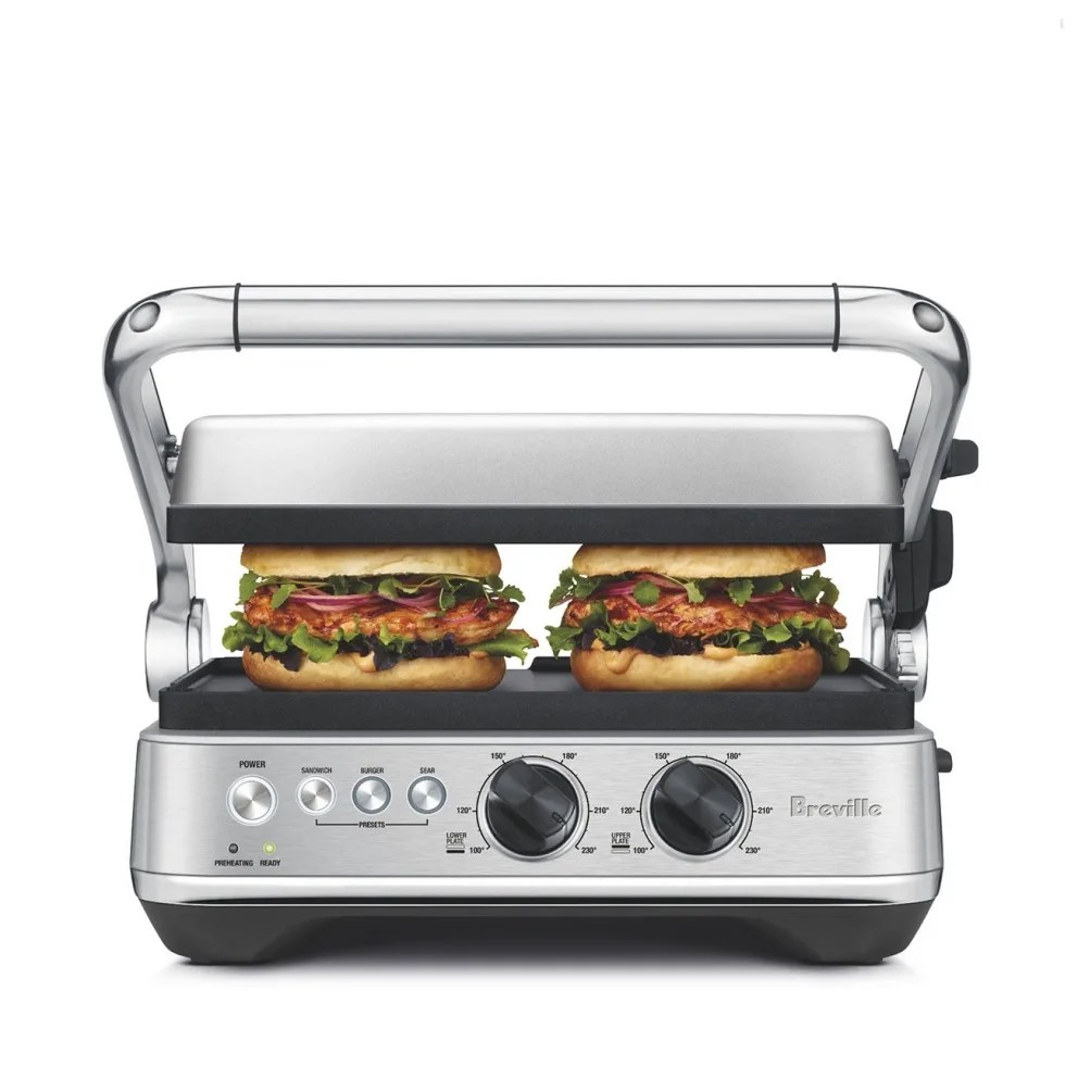 silver grill press with two sandwiches
