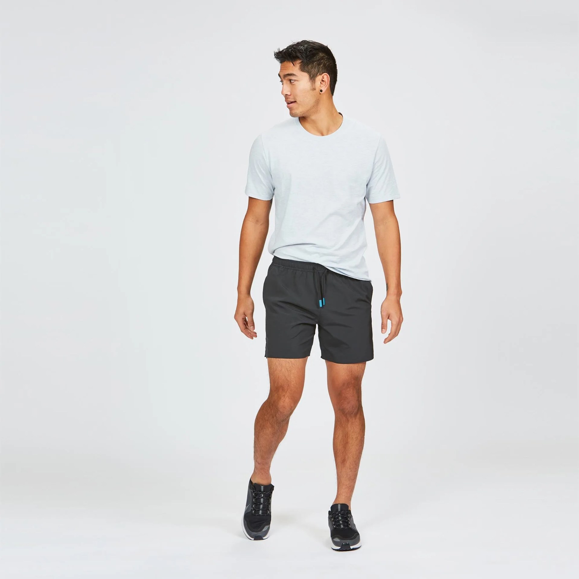 Black shorts on model with white t-shirt