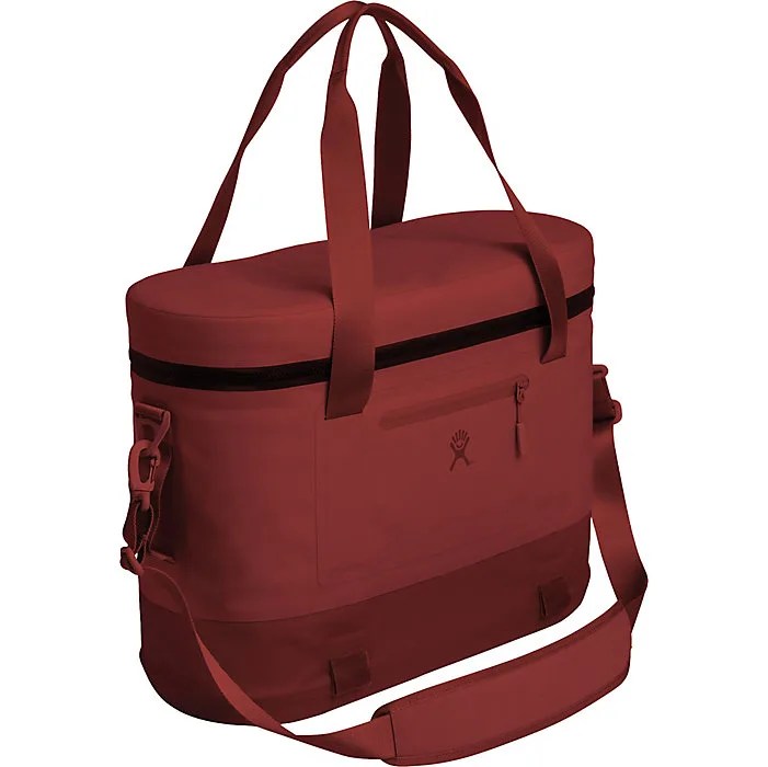 a red soft cooler in the shape of a tote with multiple handles