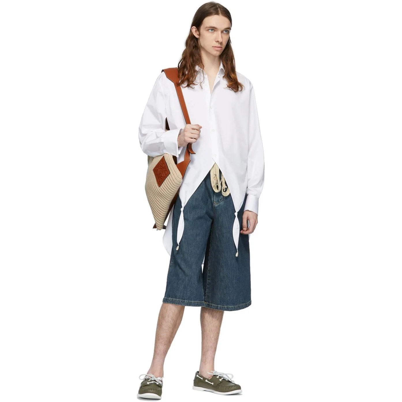 model wearing denim shorts and white shirt