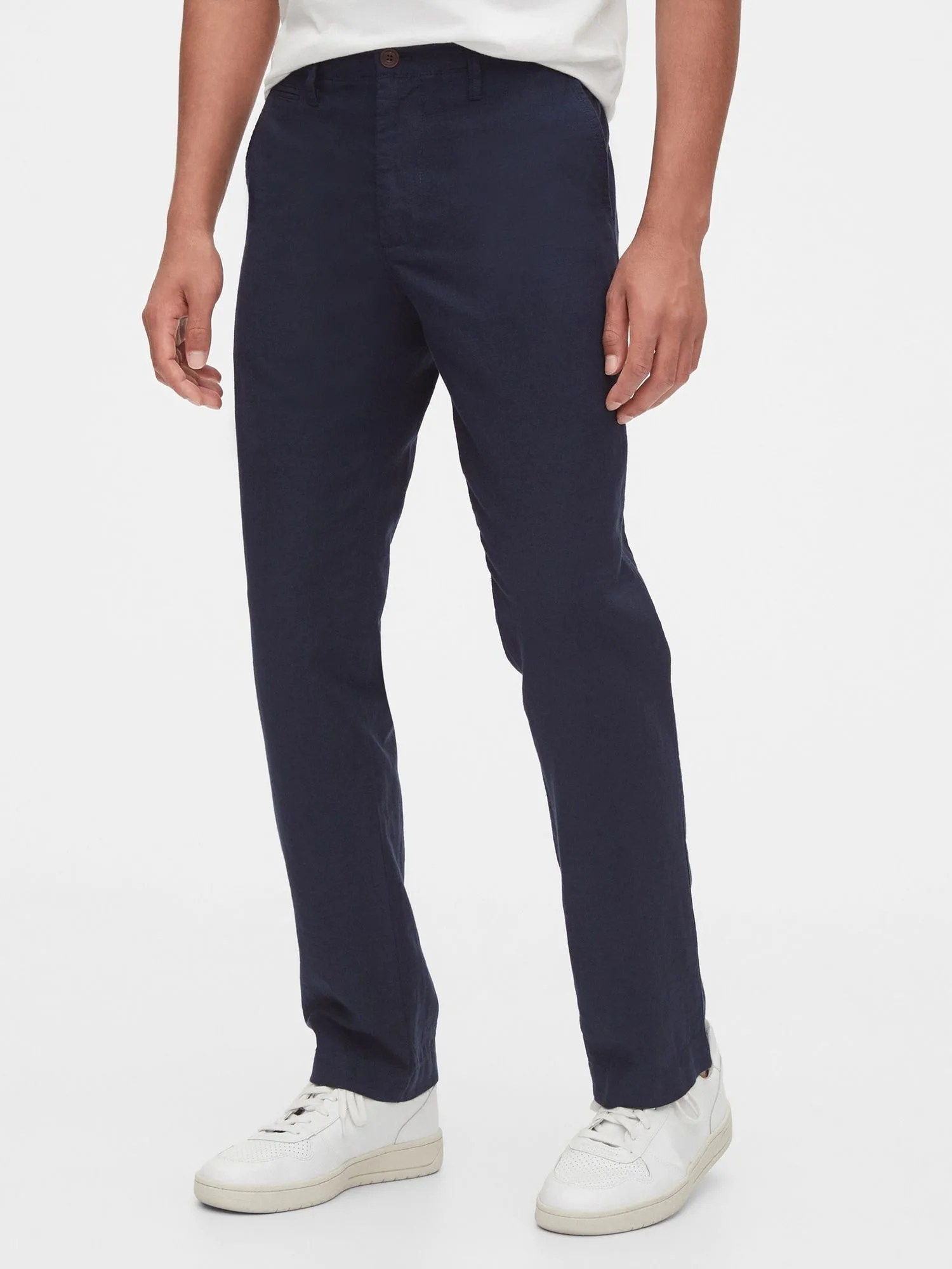 navy chinos and white sneakers on model