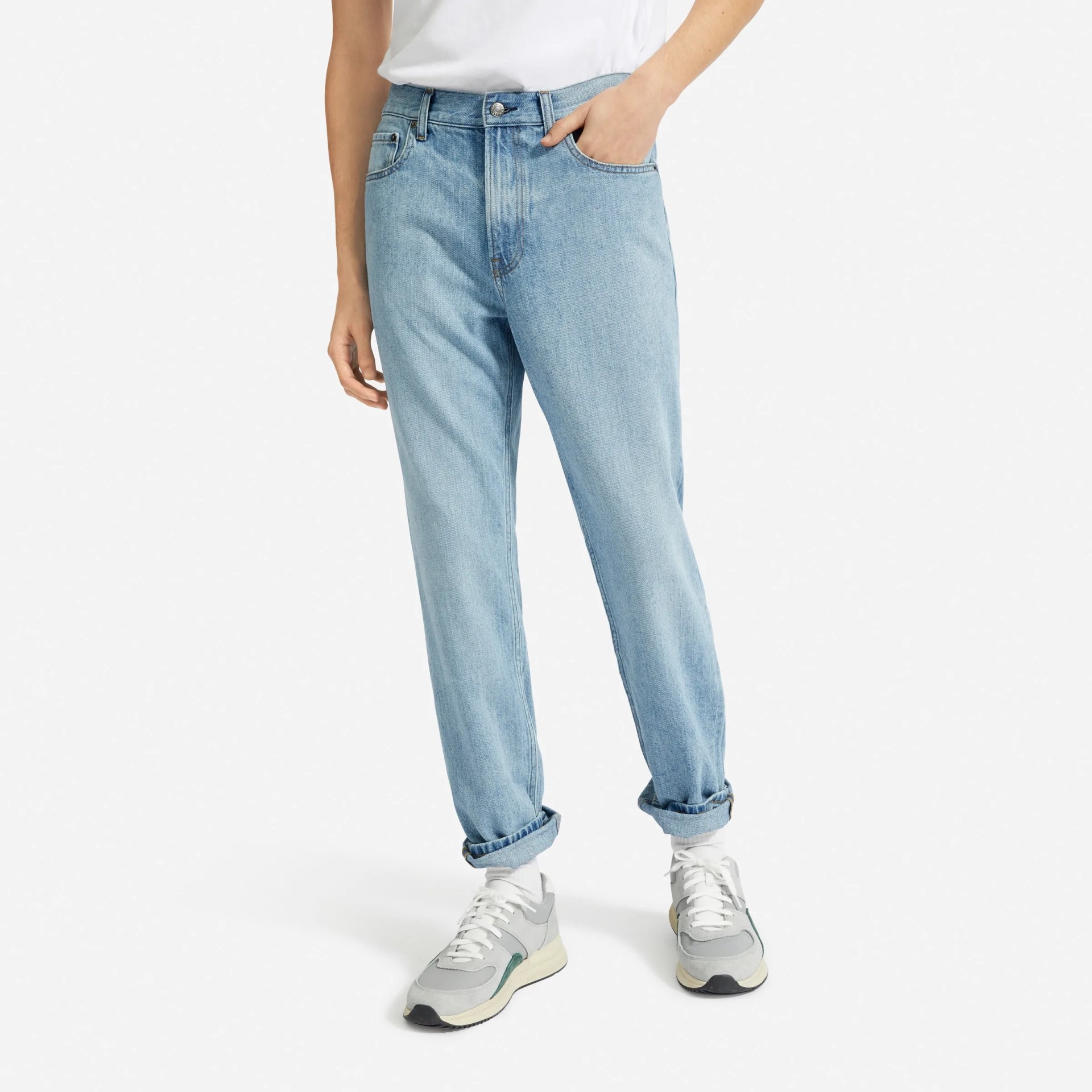 Light wash relaxed jean on model with white t-shirt and sneakers
