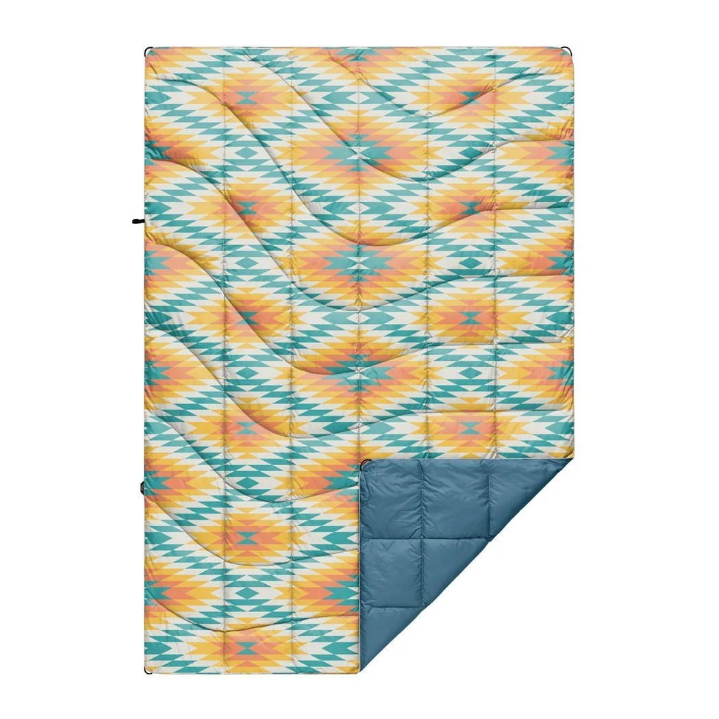 A yellow, blue and orange Navajo print blanket on a white background.