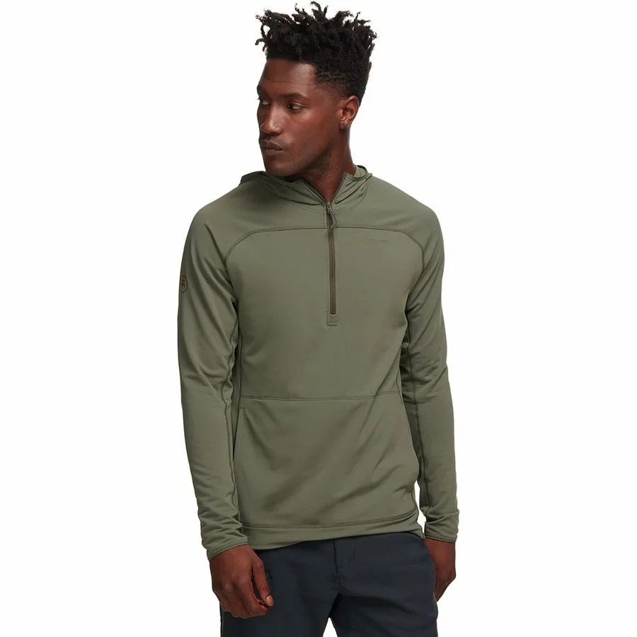 a man wearing a green quarter zip pullover