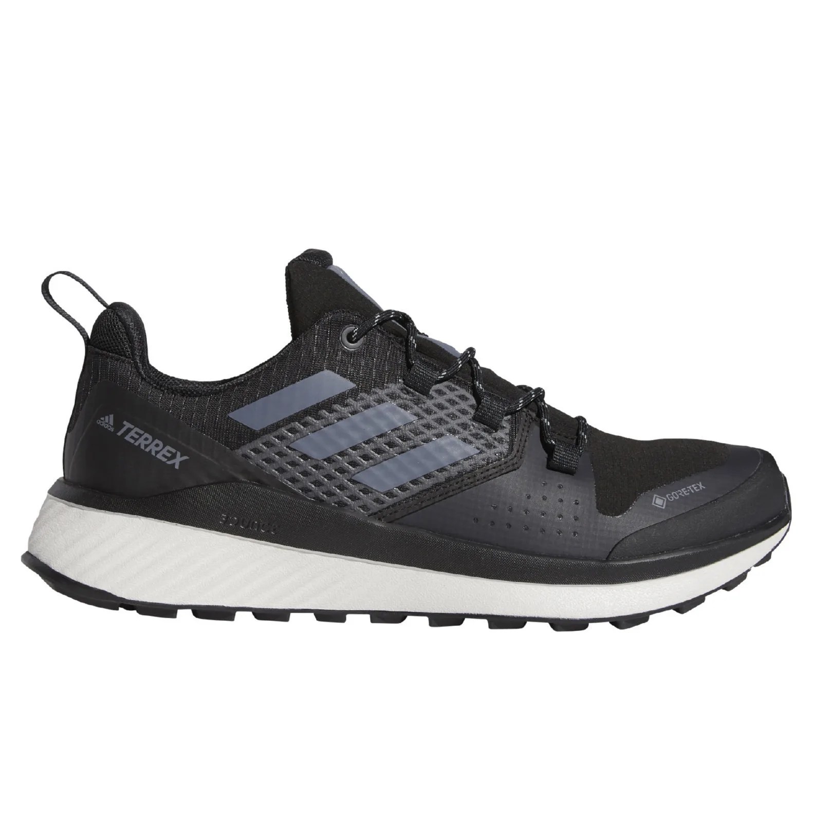 A black and gray Adidas hiking sneaker on a gray background.