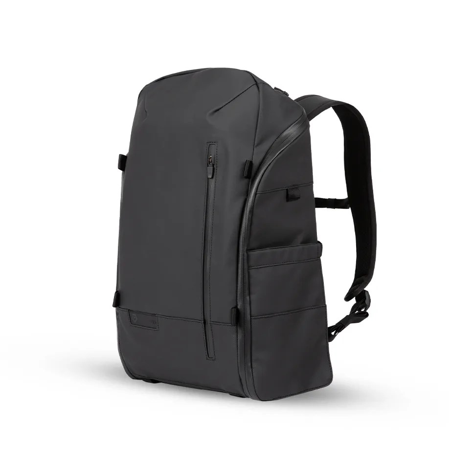a black backpack with multiple zippered pockets