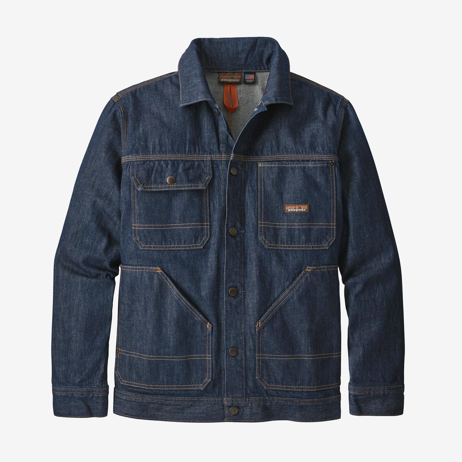 A dark blue jean jacket on a gray background.