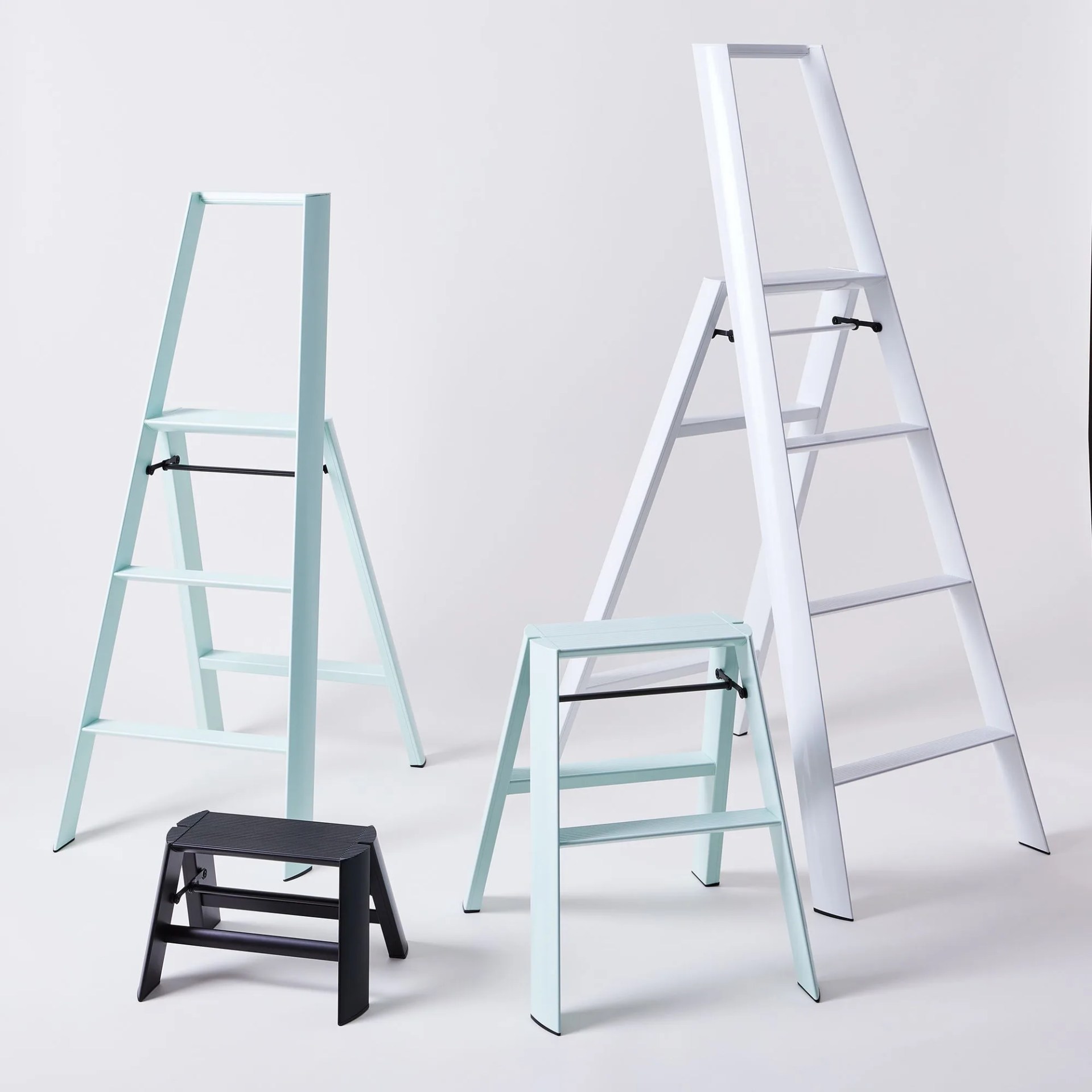 four ladders of varying sizes