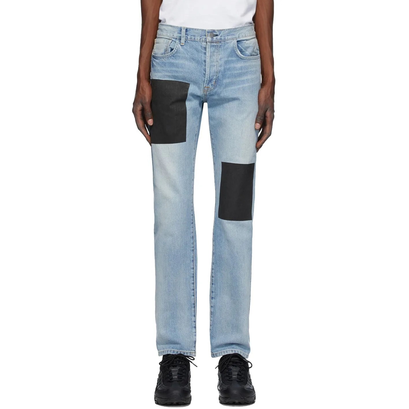 blue patched jeans on model
