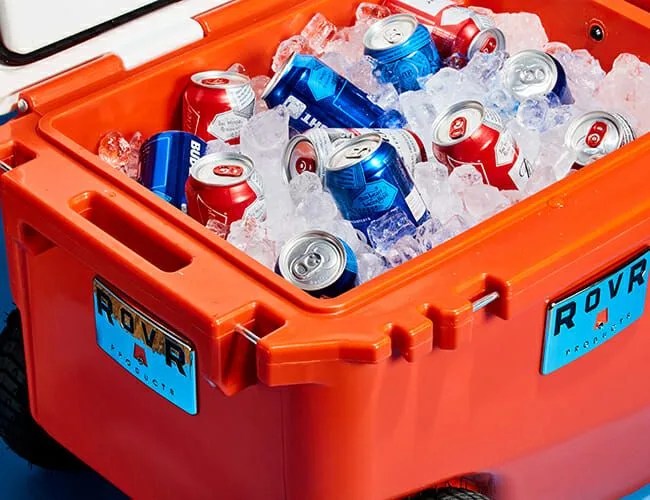 a red cooler filled with ice and beer