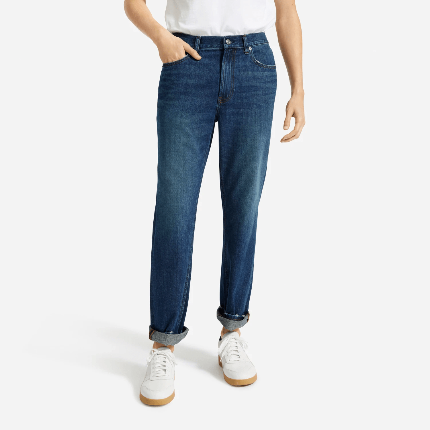 blue jeans and white sneakers on model