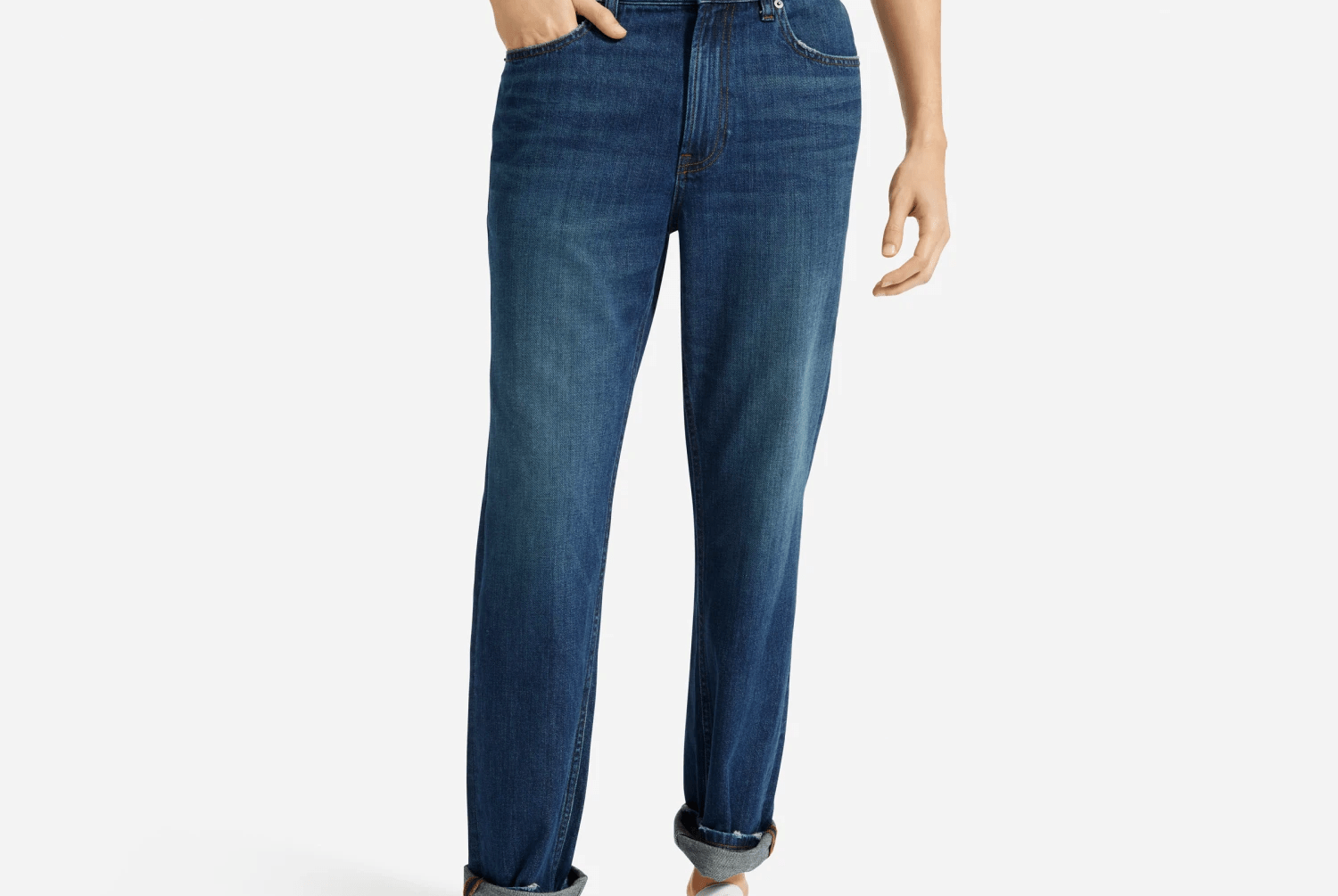 blue jeans and white sneakers on model