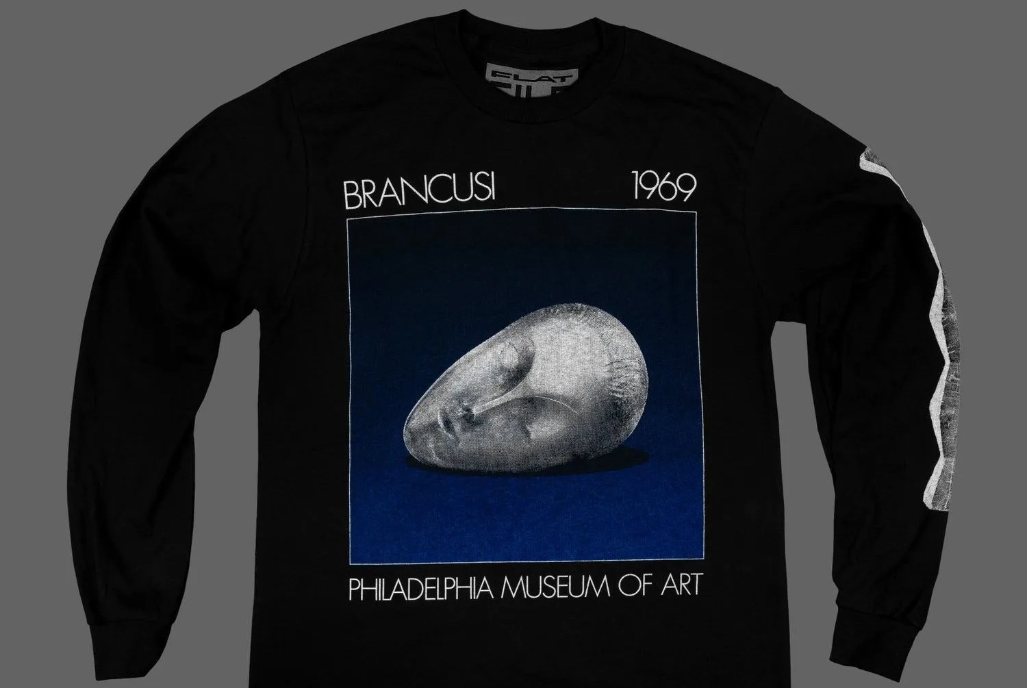 black t shirt with brancusi sculpture of a human head