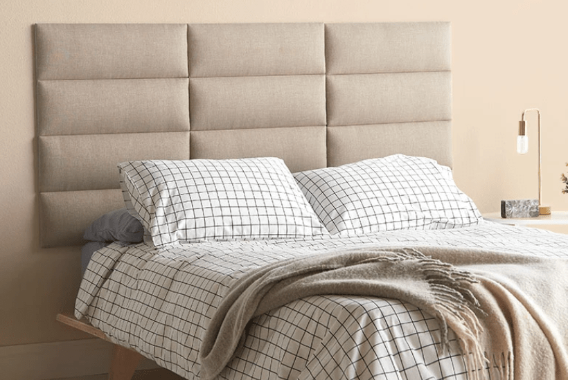tan modular headboard and grid bedding