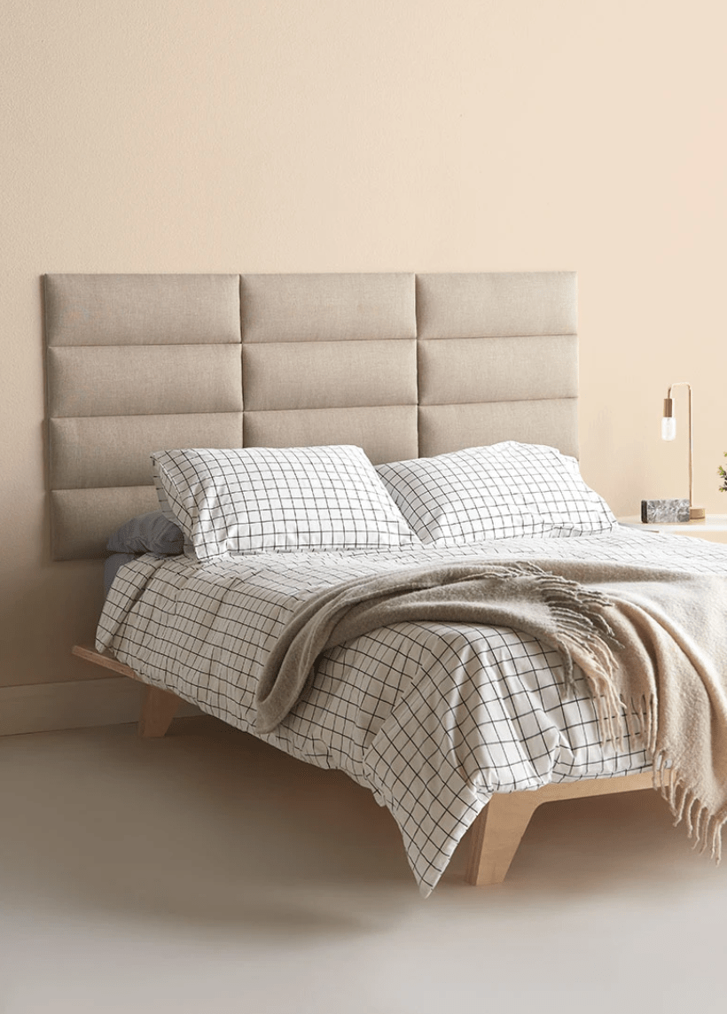 tan modular headboard and grid bedding