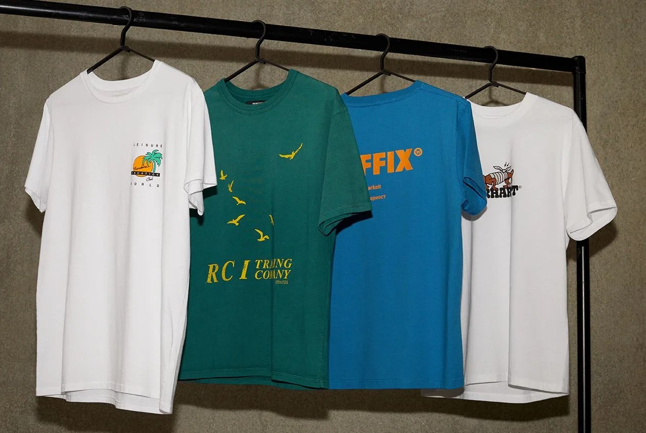 graphic tee shirts hanging on clothing rack