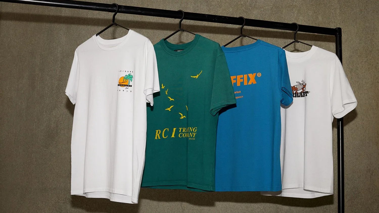 graphic tee shirts hanging on clothing rack