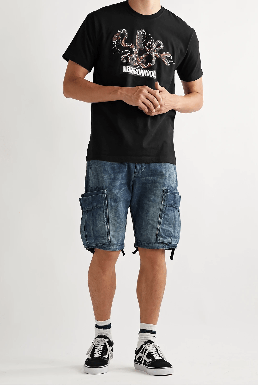 denim shorts and black t shirt on model