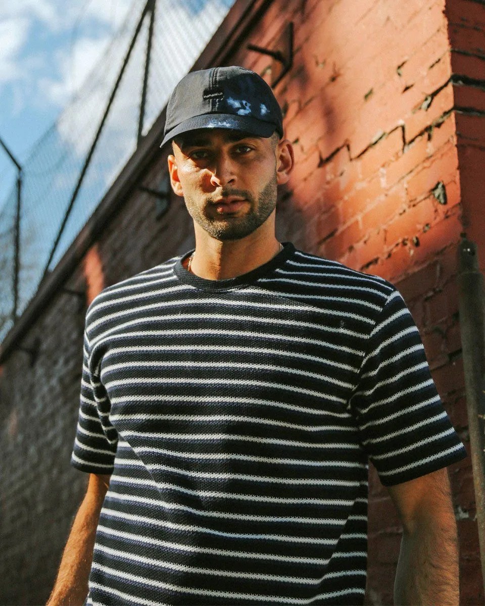 black and white striped shirt on model