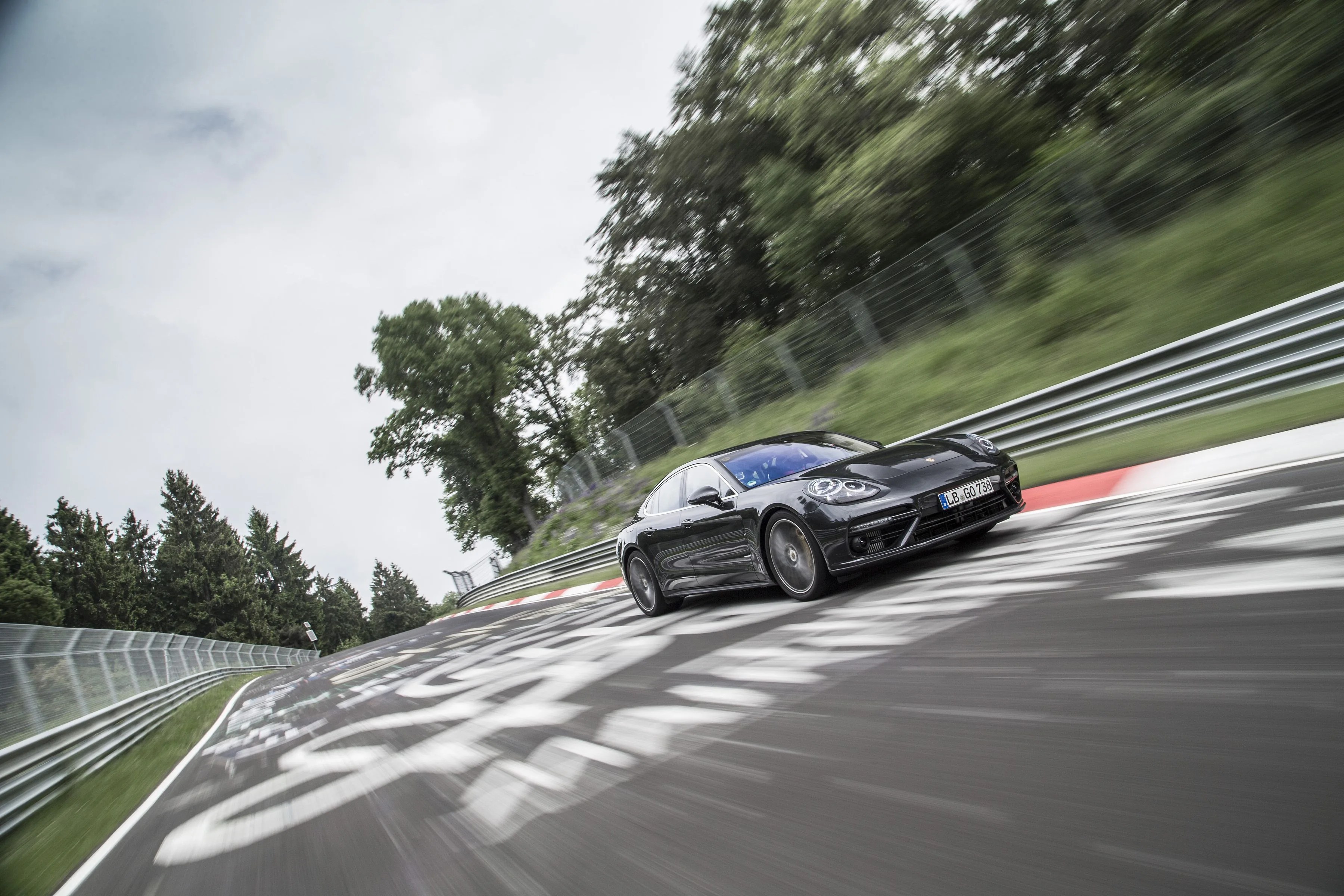 the porsche panamera turbo on the nurburgring race track going fast