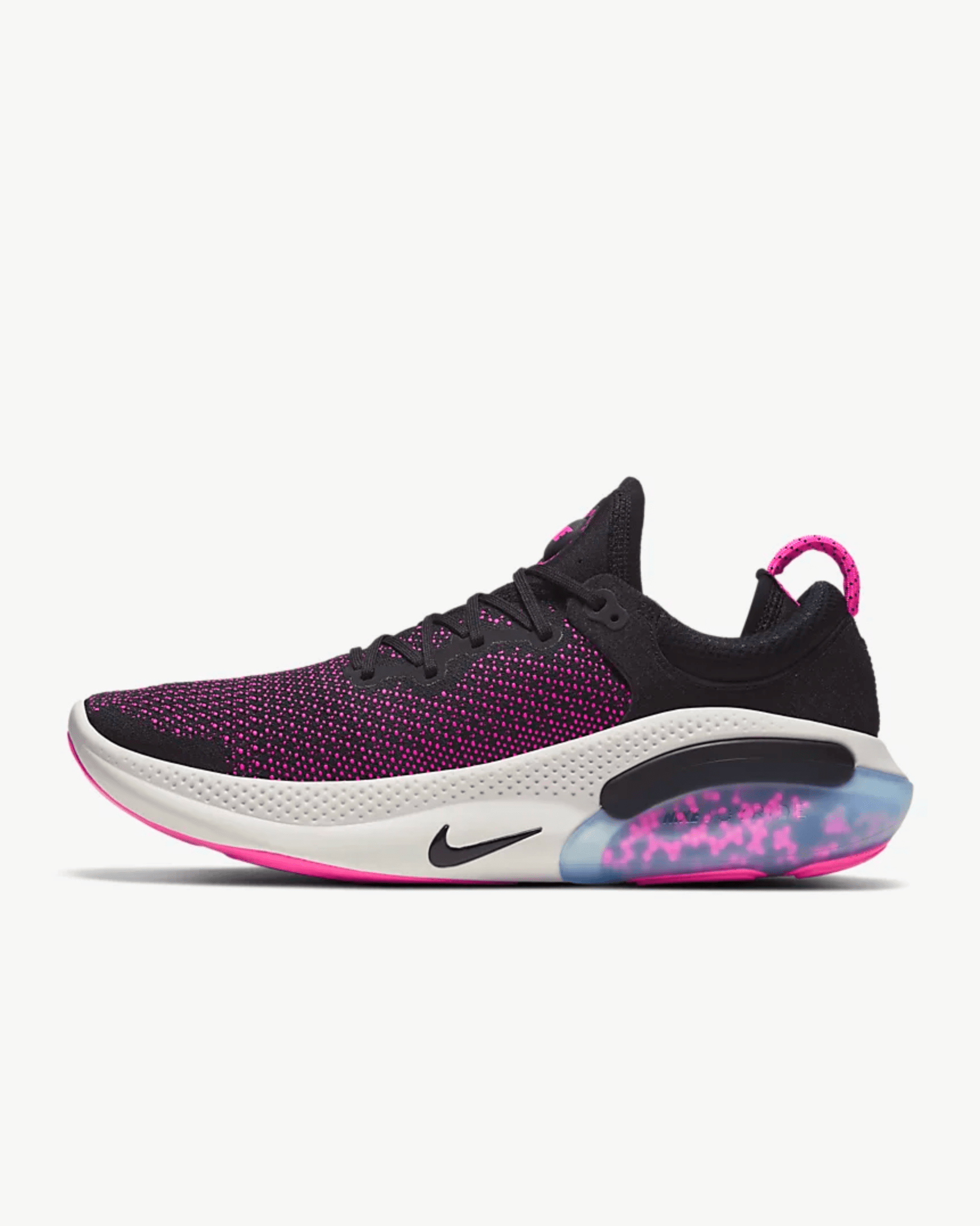 A black, pink and purple sneaker on a gray background.