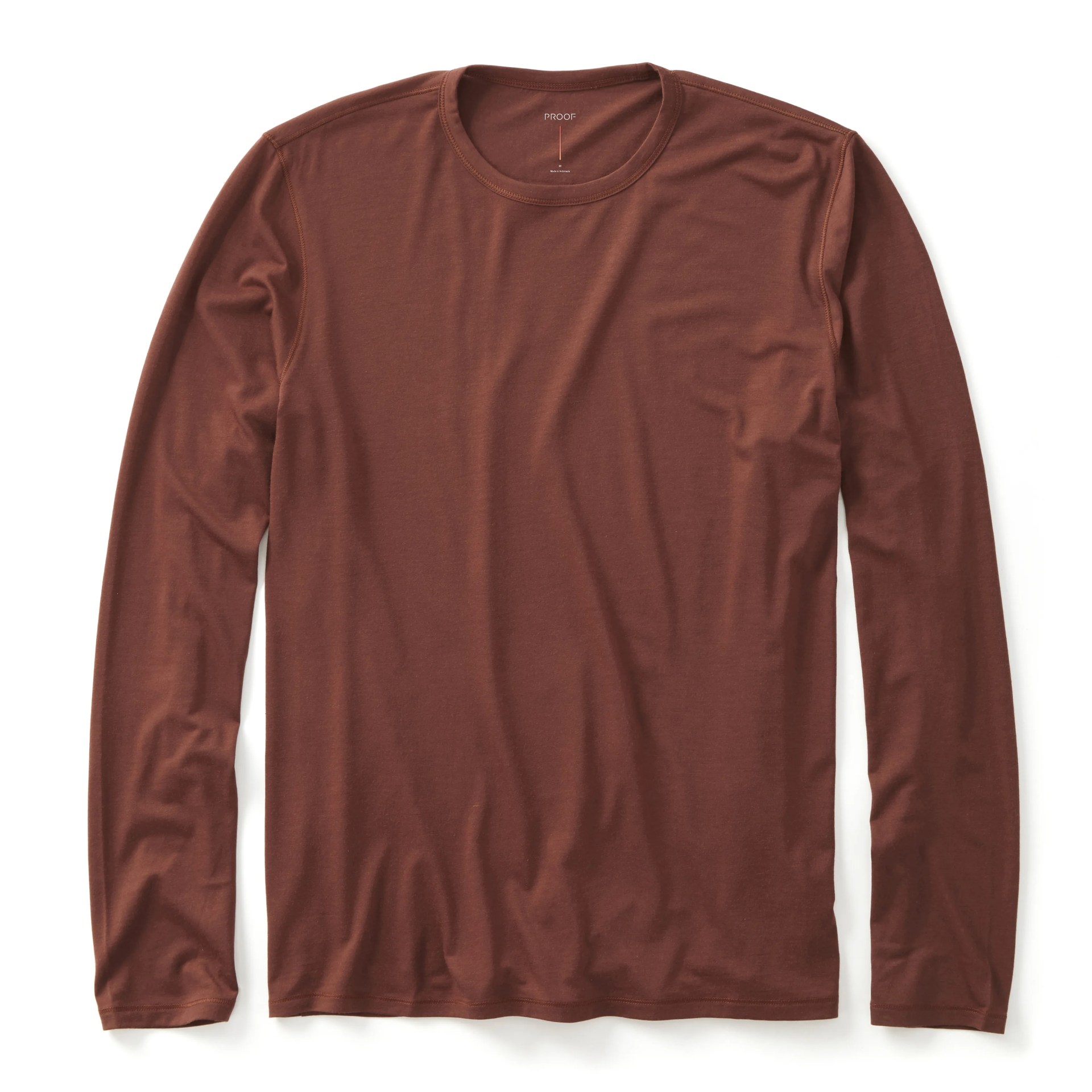 A red longsleeve shirt on a gray background.