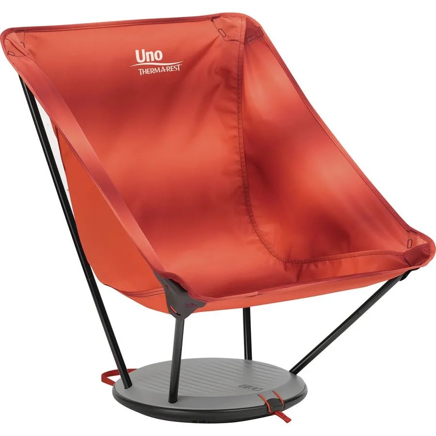 a red camping chair with a circular base