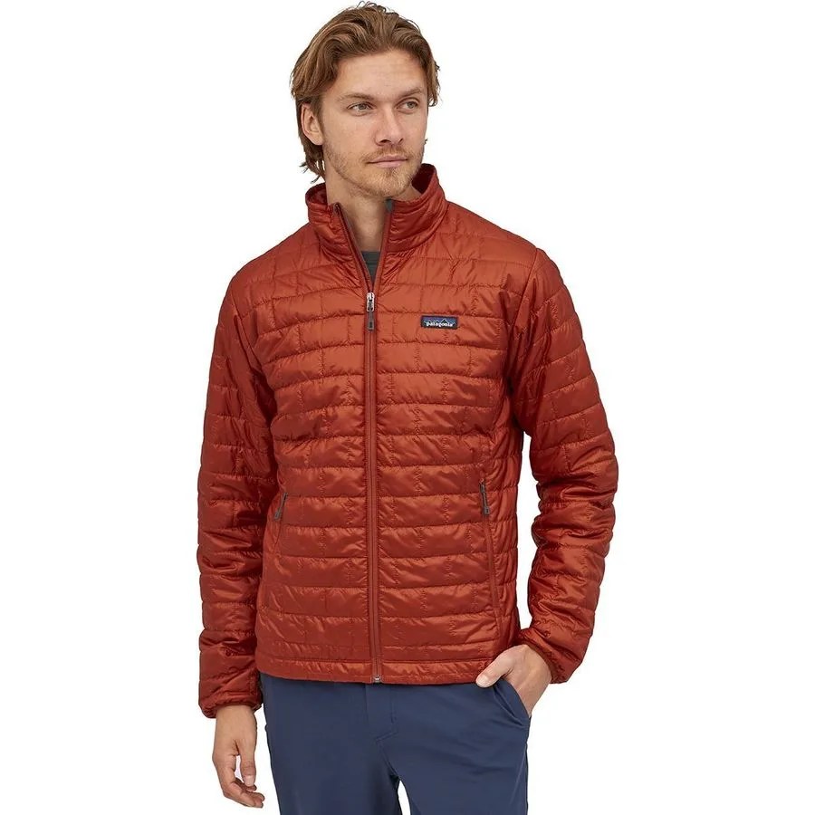 a man wearing a red insulated jacket
