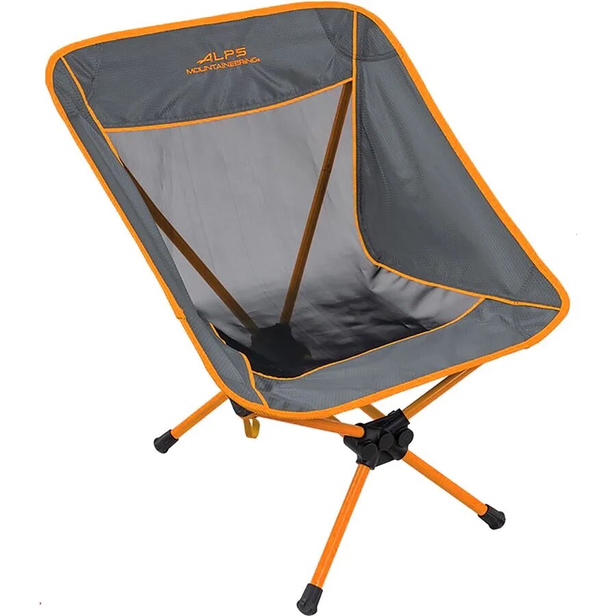 A gray and orange camp chair on a gray background.