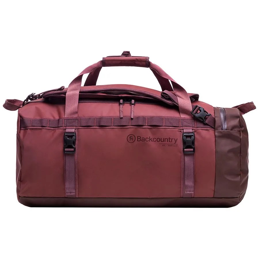 A red duffel bag on a gray background.